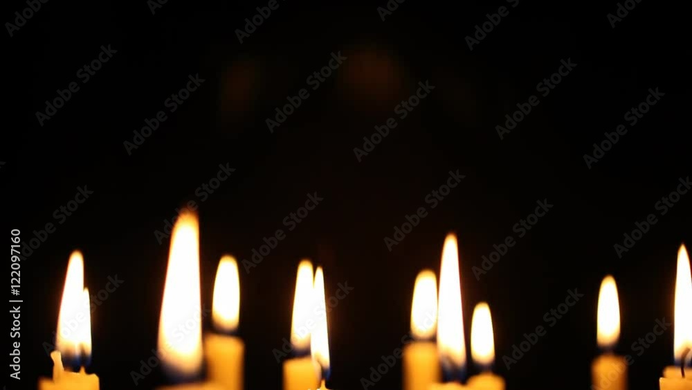 A slow panning shot down on tall candles with selective focus. HD 1080 A slow panning shot down on tall candles with selective focus. HD 1080