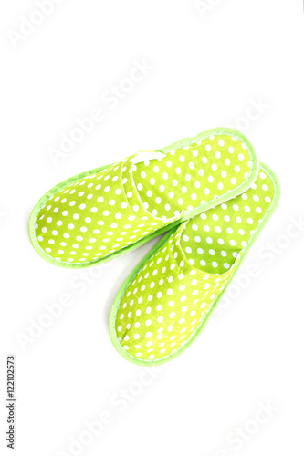 Foto green slippers on a white background