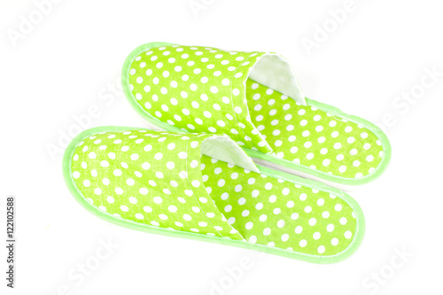 Foto green slippers on a white background