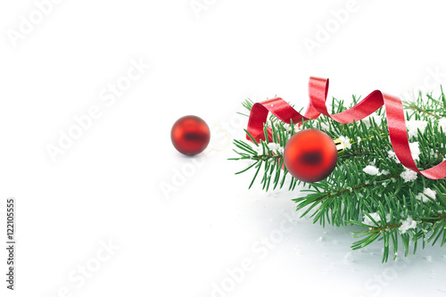 Frame of Christmas tree branches with red baubles, ribbon and sn photo