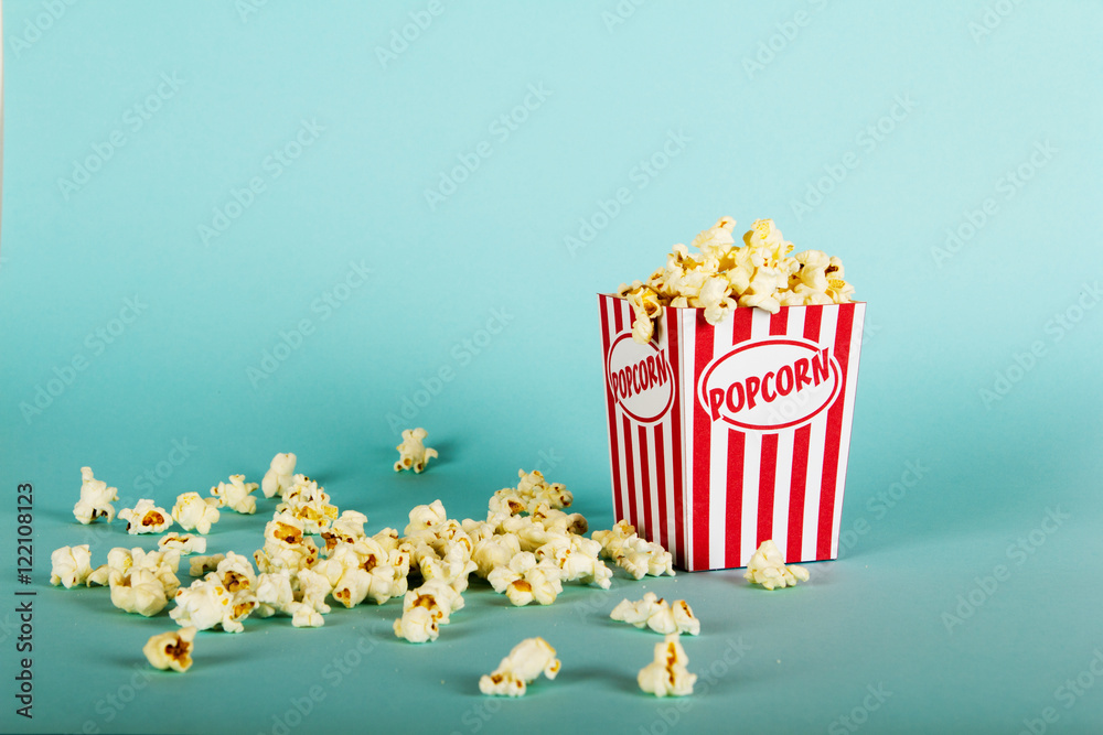 Popcorn bucket against a blue background