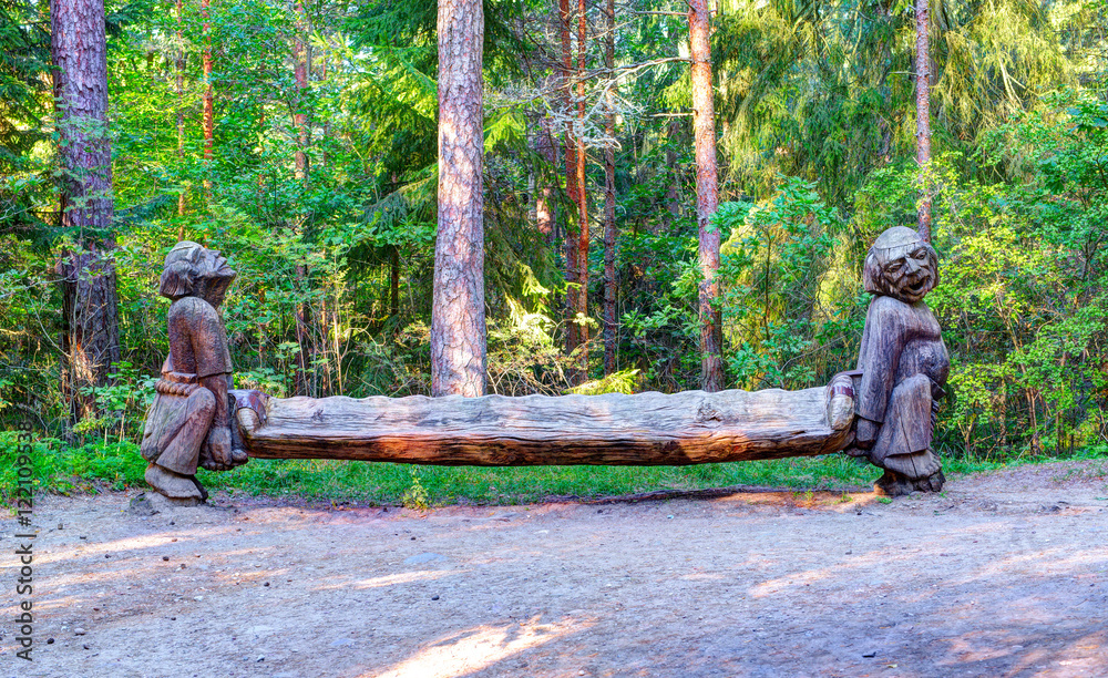 Old wooden sculptures in the forest. Witch Hill park, Lithuania. Old wooden sculptures in the forest. Witch Hill park, Lithuania.
