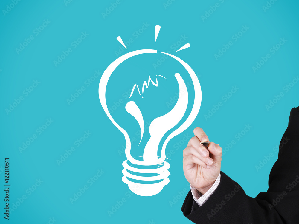 businessman writing on light bulb businessman writing on light bulb