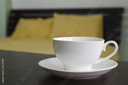 hot coffee or tea on table in bedroom
