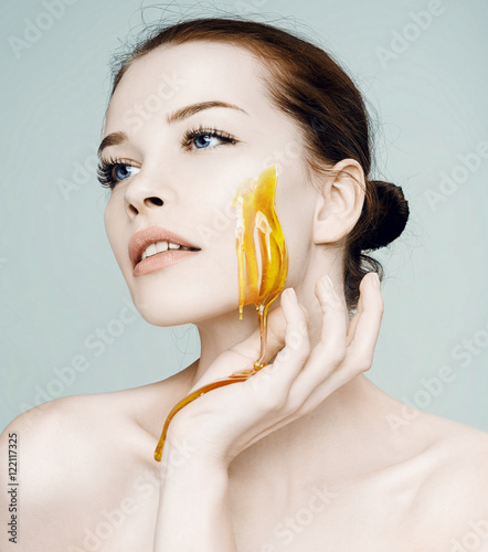 Fashion Beautiful woman.Honey on a face. Mascara Applying.Eyes M