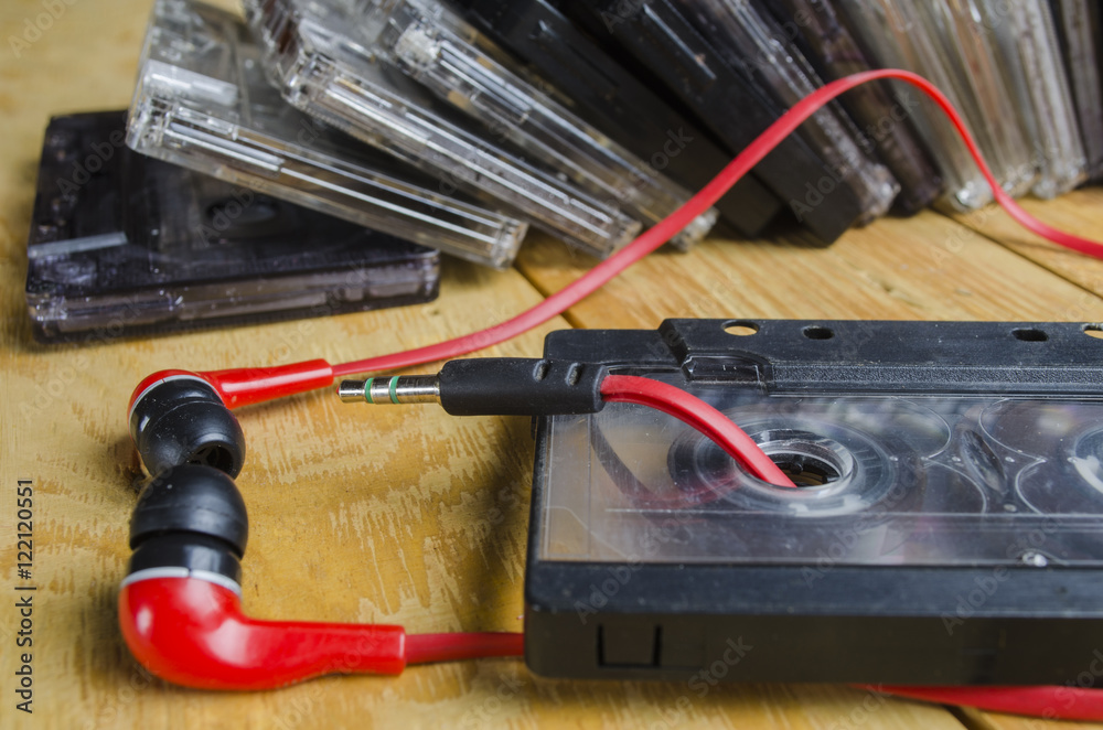 the cartridge for the tape recorder on a wooden table the cartridge for the tape recorder on a wooden table