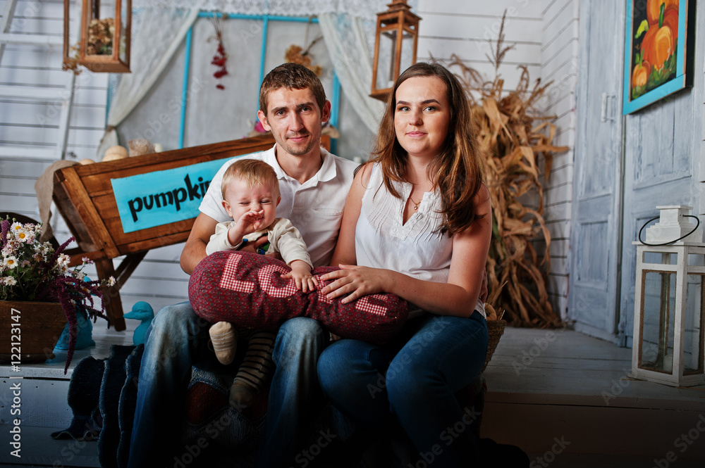 Young caucasian happy family with baby boy hold pillow with the