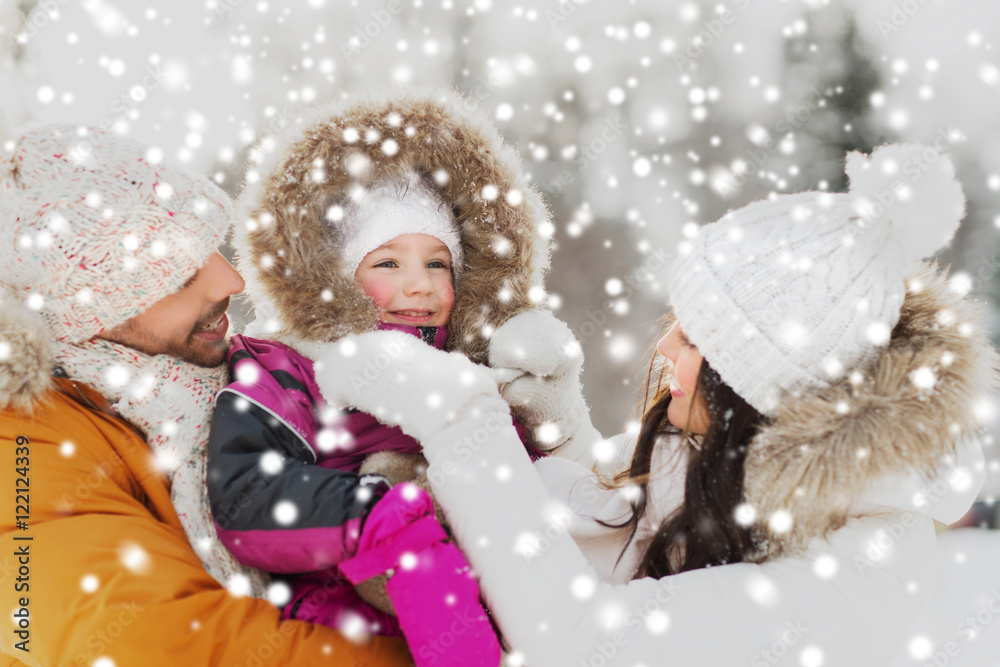 happy family with child in winter clothes outdoors happy family with child in winter clothes outdoors