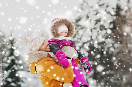 happy family in winter clothes outdoors