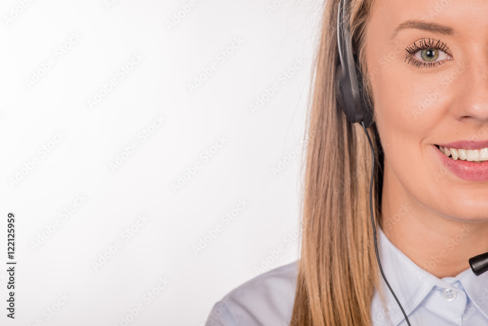 Female customer support operator with headset and smiling Female customer support operator with headset and smiling