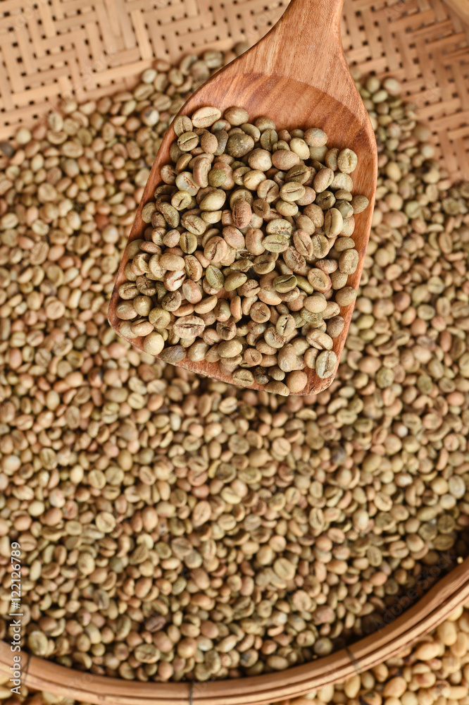 Coffee beans on wooden spoon for background Coffee beans on wooden spoon for background