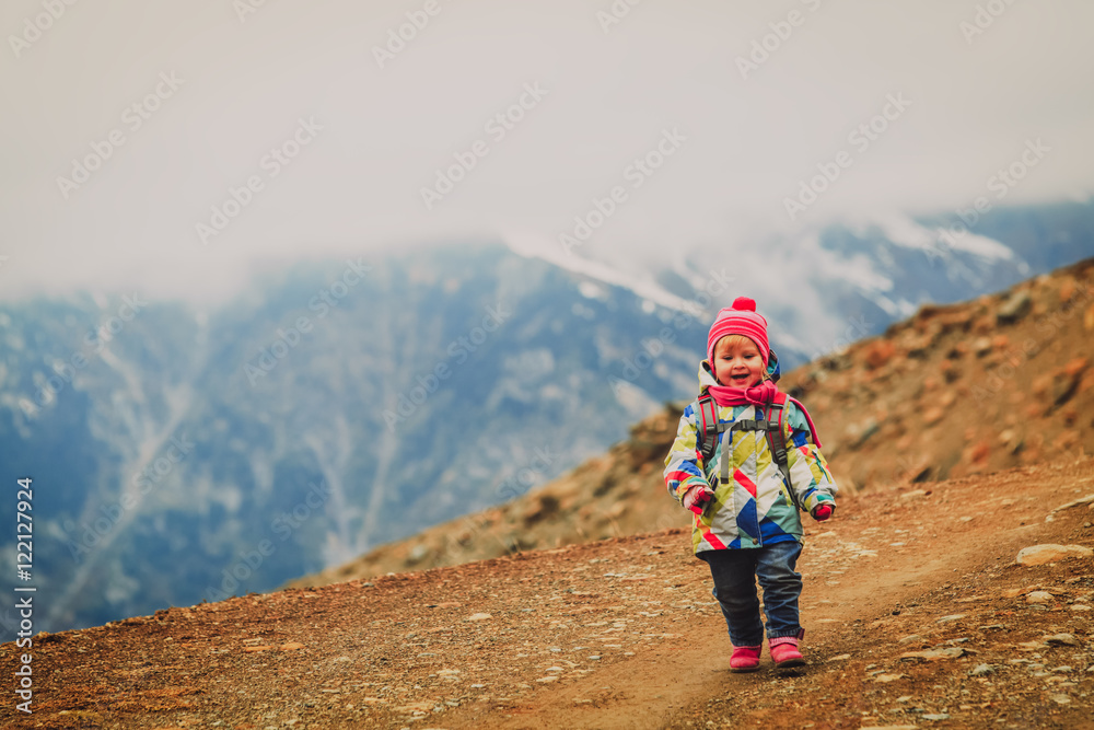 little girl walking in mountains, kids travel