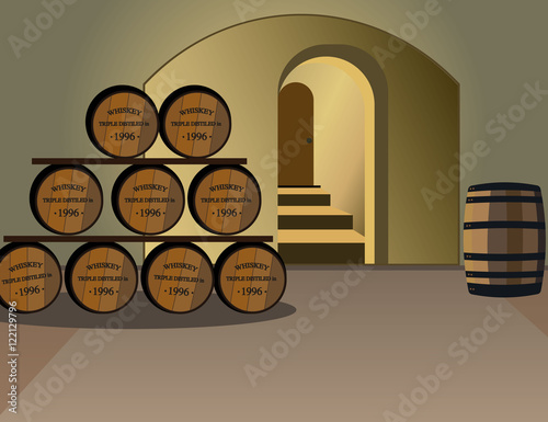 Wine cellar with barrels of alcohol. An old wine barrels. Wooden barrels of whiskey