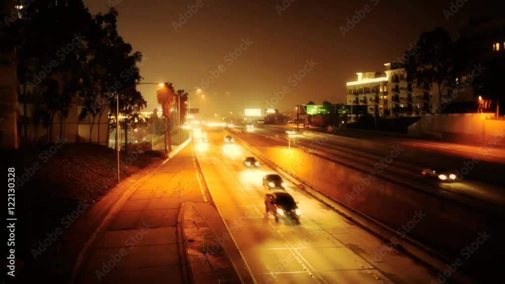 Looking down over traffic on a freeway at night.