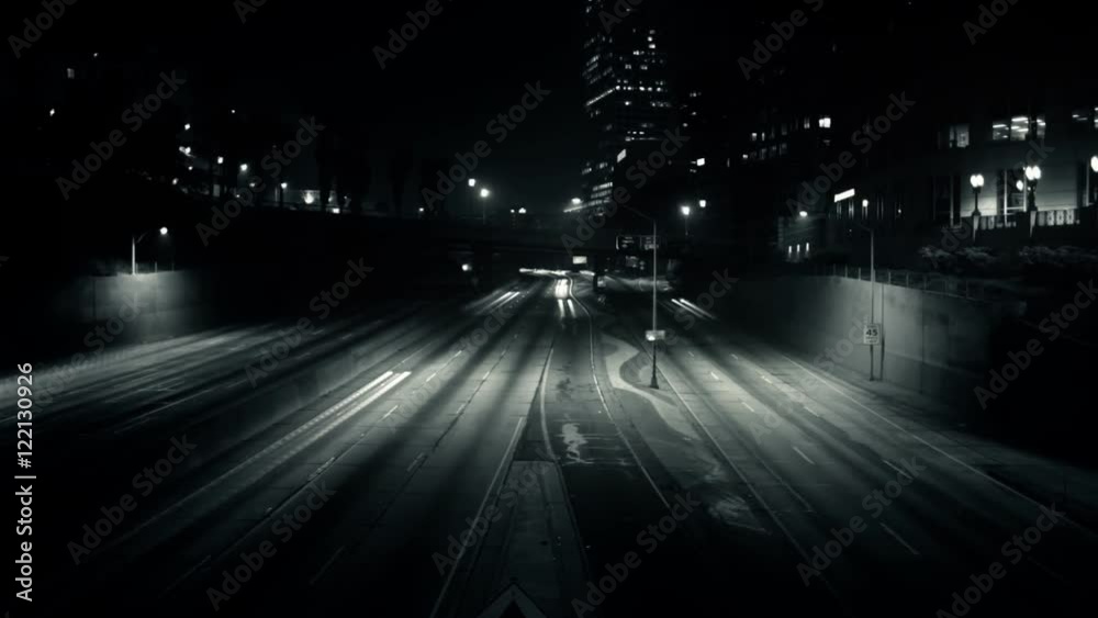 A surreal time lapse of traffic streaking across the freeway.