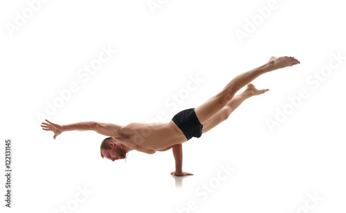 Sport. Studio photo of athlete doing handstand