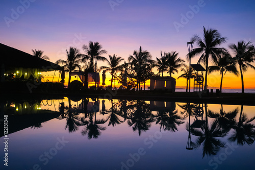Island Palm Tree Reflection by Resort Pool, Orange and Purple Beach Sunrise - Bohol, Philippines