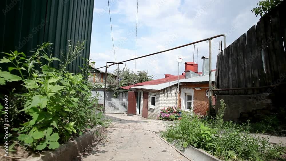 Views of a town. Old city streets. Exterior of the old single storey residential house from white and red brick. HD