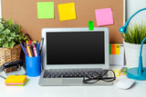 Work place of a creative person with a variety of colorful stationery objects