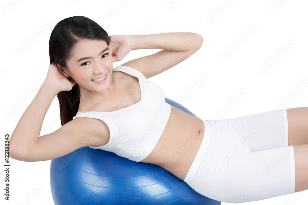 Fototapeta premium Asian women are practicing sit-ups fitness ball (Pilates Ball).w