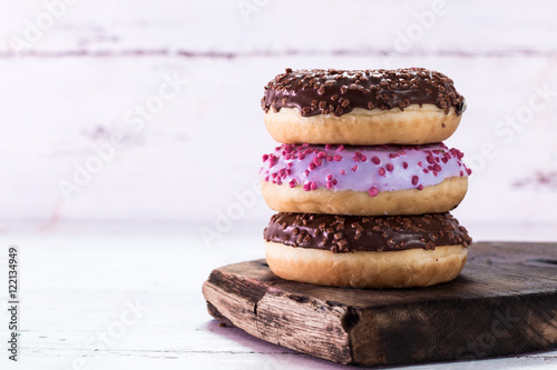 Donut. Sweet icing sugar food. Dessert colorful snack. Glazed sprinkles.