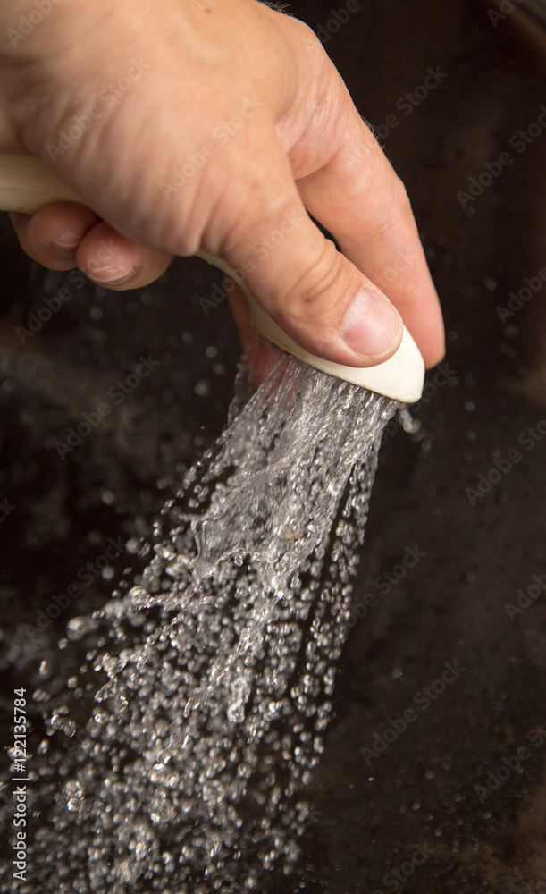 Water from the shower in your hand Water from the shower in your hand