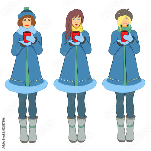 Warmly dressed girls hold hot drinks in hands.