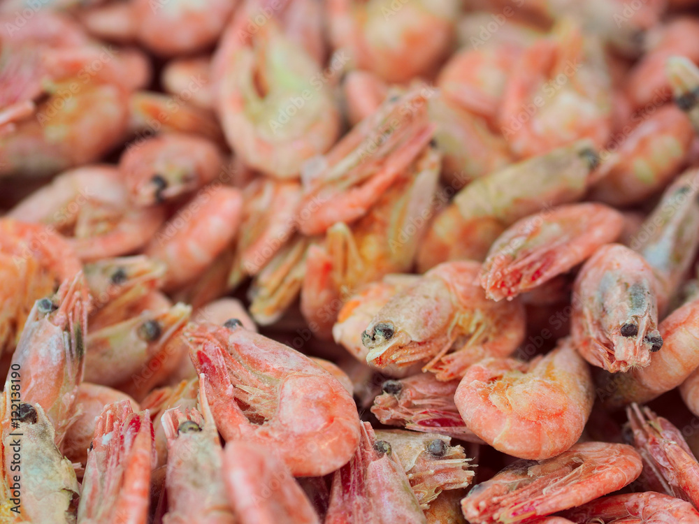 Frozen shrimps background on fish market, view from top Frozen shrimps background on fish market, view from top