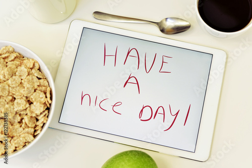 Foto text have a nice day in a tablet