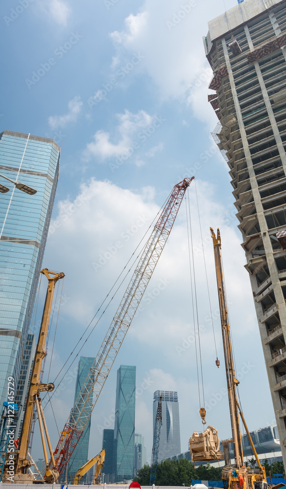 Construction site with crane and tall building background of Shenzhen City, China