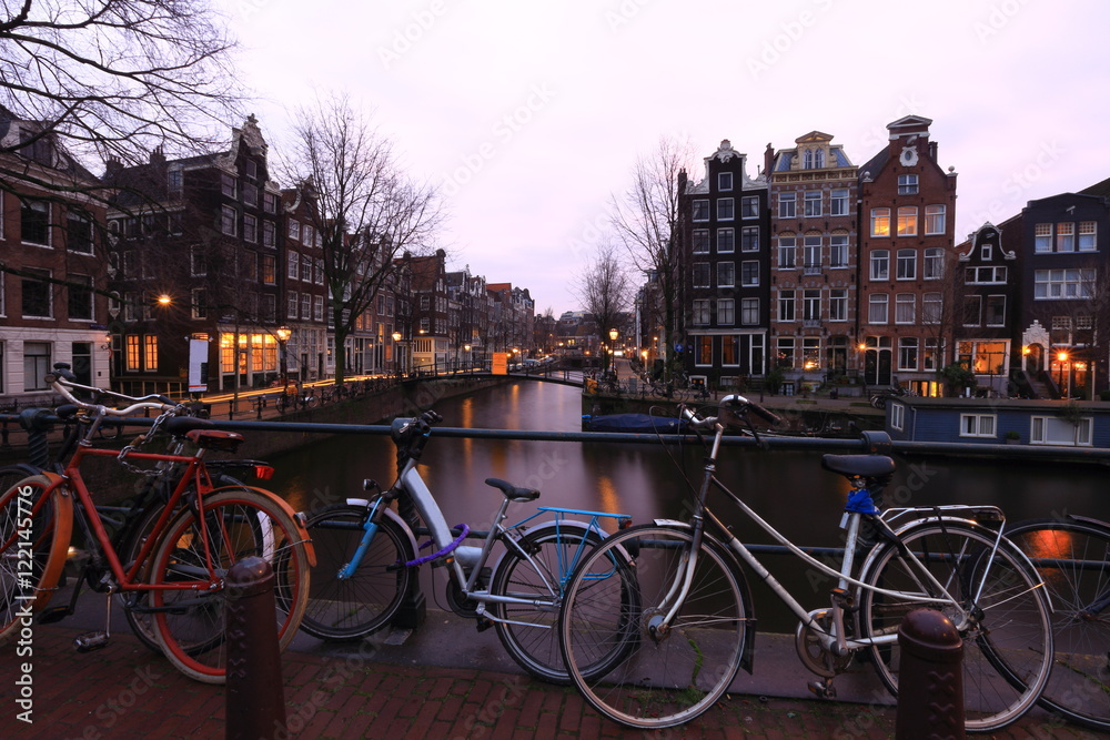 Bicycles on a bridge over the canals of Amsterdam, Netherlands