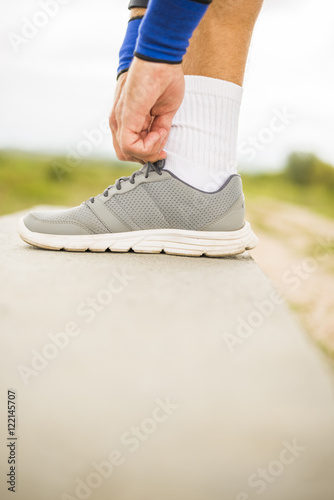 Runner Tying his Shoes