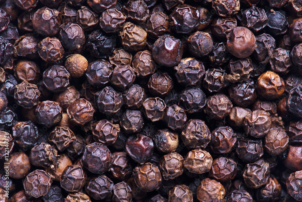 Black pepper grains as background close up. Black pepper seeds. Black pepper grains as background close up. Black pepper seeds.