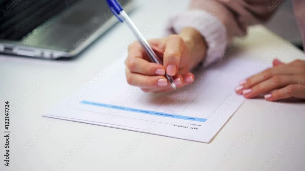 businesswoman with laptop and paper