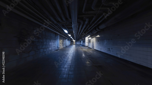 Smooth camera steady slide shot around old long extended industrial house tunnel basement, with grudge walls, rusty ripes, metal flour and broken lamps, perfect for or movie clips background