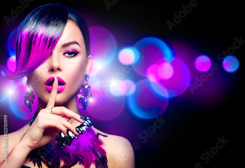 Sexy beauty fashion woman with purple dyed fringe hairstyle isolated on black background