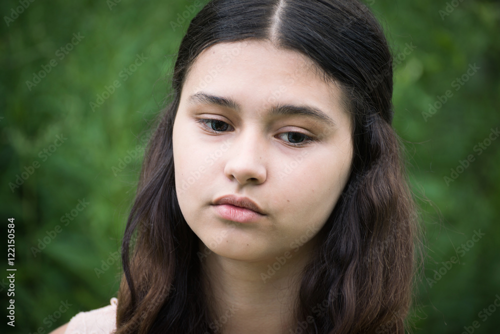 Portrait of beautiful girl looking to the down Portrait of beautiful girl looking to the down