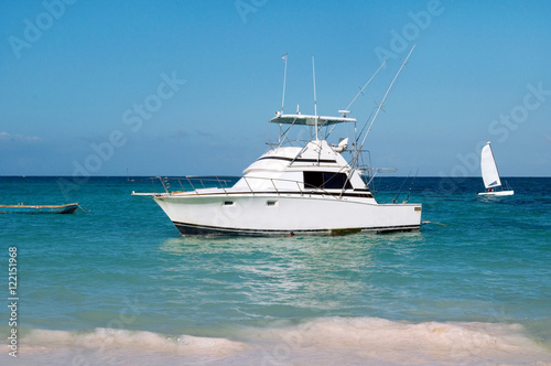 pleasure yacht anchored off the coast of the Dominican Republic. ocean tropical © Евгений Кожевников