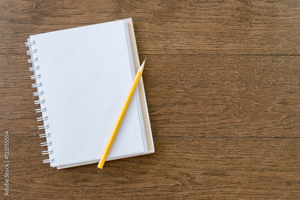 blank white notebook on wooden texture background blank white notebook on wooden texture background