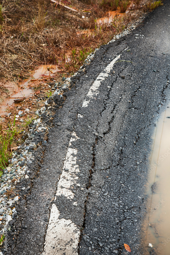 Asphalt surface, the curve of the road were demolished due to poor construction. Asphalt surface, the curve of the road were demolished due to poor construction.