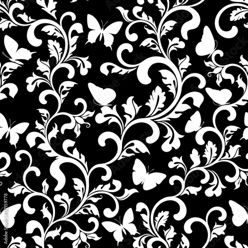 Seamless pattern with white tracery and butterflies on a black background