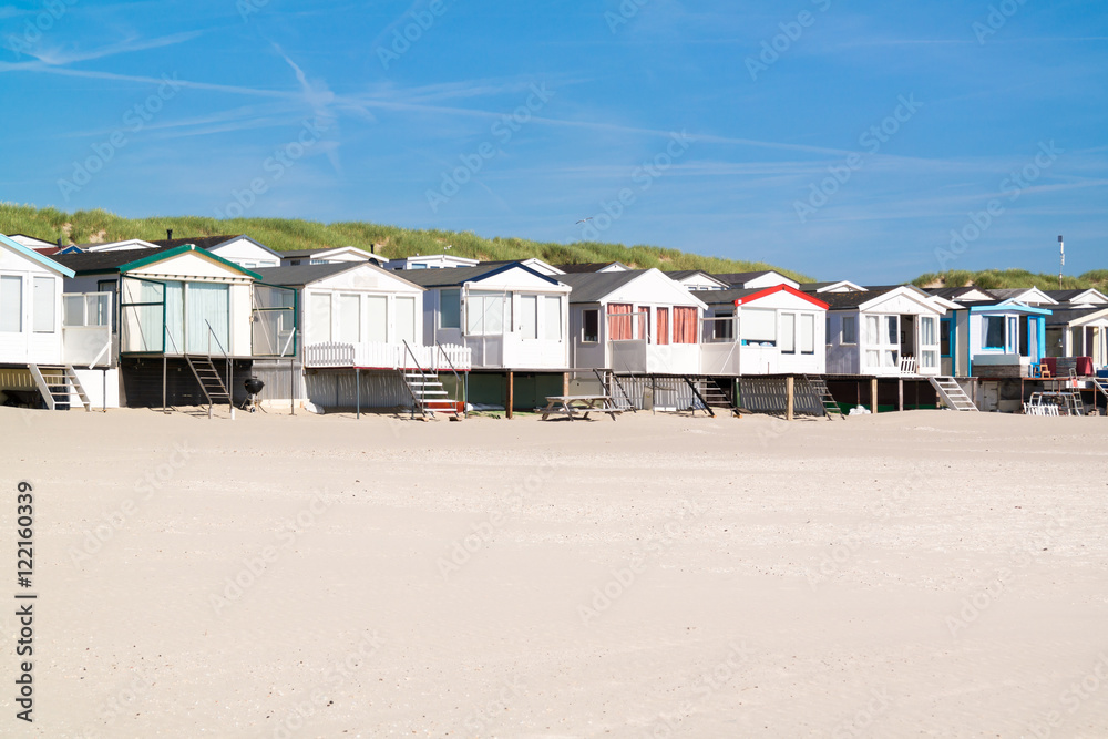 Row of beach houses or huts on IJmuiden beach at North Sea coast in Netherlands Row of beach houses or huts on IJmuiden beach at North Sea coast in Netherlands