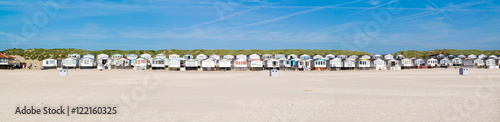 Row of beach houses or huts on IJmuiden beach at North Sea coast in Netherlands