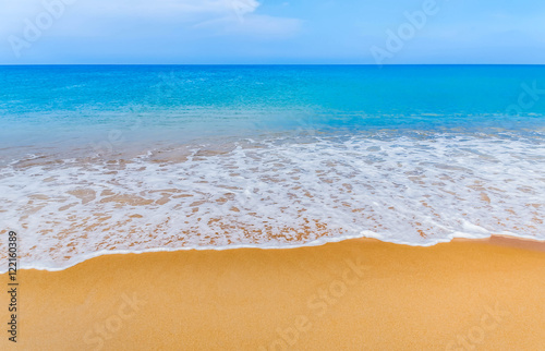 white soft wave on the beach and blue sea 