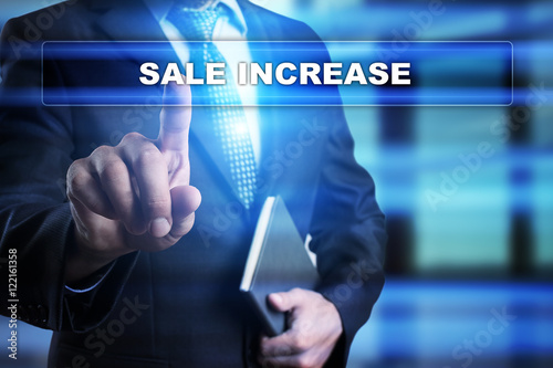 Businessman is pressing button on touch screen interface and selecting "Sale increase". Business concept.