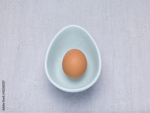 Single Egg in a bowl on a table