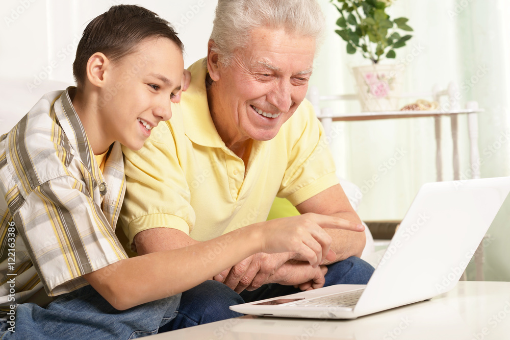 boy and grandfather with laptop boy and grandfather with laptop