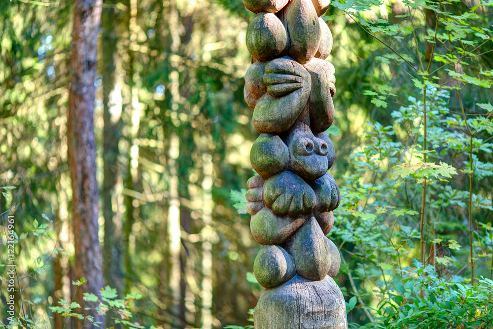 Old wooden sculptures in the forest. Witch Hill park, Lithuania. Old wooden sculptures in the forest. Witch Hill park, Lithuania.