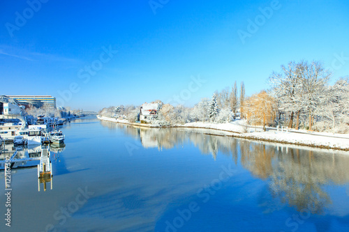 The picturesque landscape of the river snowy shore © Margarita Borodina