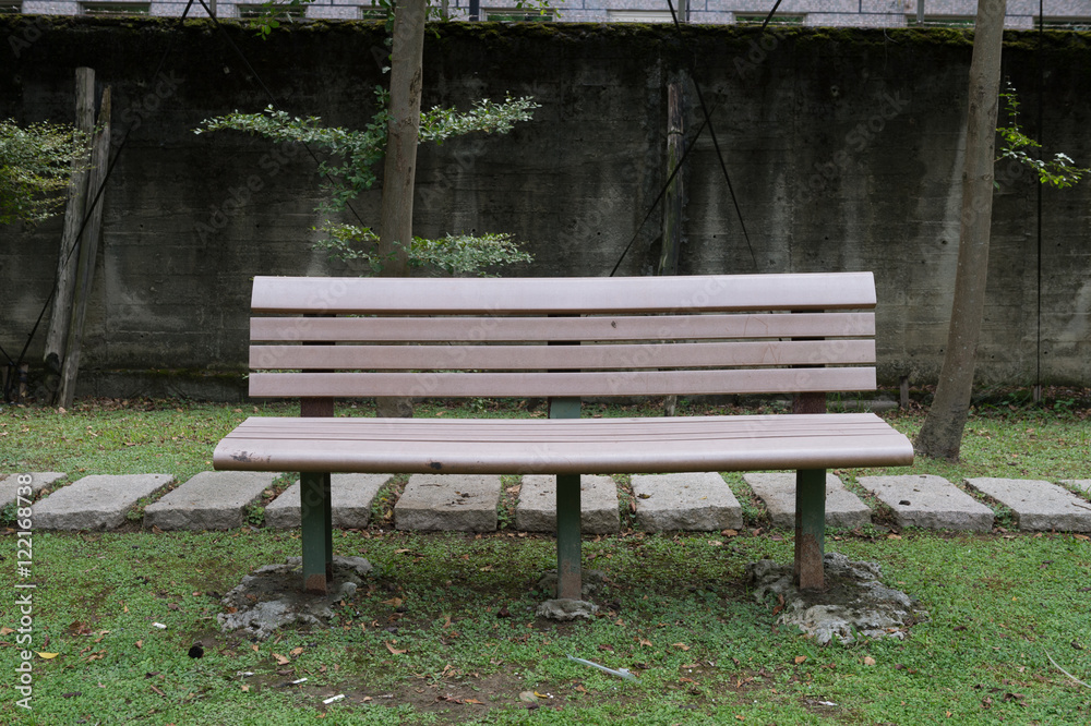 wooden park bench at a park